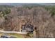 Expansive aerial view of the home showcasing its architectural design nestled among mature trees and landscaping at 109 Hawksnest Ln, Mooresville, NC 28117