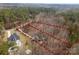 An aerial view of this large parcel outlined in red, showcasing the home's placement within a wooded lot and a winding driveway at 109 Hawksnest Ln, Mooresville, NC 28117