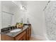 Bathroom featuring double sinks with granite countertops and a shower tub combination at 109 Hawksnest Ln, Mooresville, NC 28117