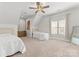 Bedroom featuring a ceiling fan, carpeted floors, and lots of natural light at 109 Hawksnest Ln, Mooresville, NC 28117