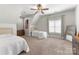 Large bedroom with two twin beds, vaulted ceilings, and neutral decor at 109 Hawksnest Ln, Mooresville, NC 28117