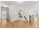 Upstairs hallway with hardwood floors and bright, white trim at 109 Hawksnest Ln, Mooresville, NC 28117