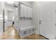 Mudroom area with cabinet storage, seating, and tile floors at 109 Hawksnest Ln, Mooresville, NC 28117