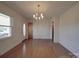 Bright, open living room featuring gleaming hardwood floors and a classic chandelier at 1120 Glenarden Dr, Rock Hill, SC 29730