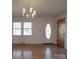 Bright, open living room featuring gleaming hardwood floors and a classic chandelier at 1120 Glenarden Dr, Rock Hill, SC 29730