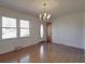 Bright, open living room featuring gleaming hardwood floors and a classic chandelier at 1120 Glenarden Dr, Rock Hill, SC 29730