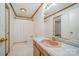 Bathroom with a pink sink, wood cabinets, and tile floors, offering a functional layout at 127 Barry Oak Rd, Statesville, NC 28625