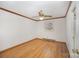 Cozy bedroom with wood floors, white walls, a ceiling fan and natural light from the window at 127 Barry Oak Rd, Statesville, NC 28625