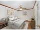 Comfortable bedroom with ceiling fan, a large bed, and an area rug at 127 Barry Oak Rd, Statesville, NC 28625