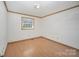 Bedroom with natural light highlighting the wood floors and neutral walls for a serene ambiance at 127 Barry Oak Rd, Statesville, NC 28625