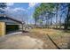 Exterior of garage, showcasing the construction with a spacious yard and mature trees at 127 Barry Oak Rd, Statesville, NC 28625