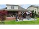 Expansive backyard features a covered patio, gazebo, and lush green lawn at 12726 Rusty Blackbird Way, Charlotte, NC 28278