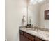 Granite countertop with stylish fixtures featured in the half bathroom at 12726 Rusty Blackbird Way, Charlotte, NC 28278