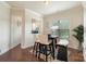 Cozy breakfast nook with bench seating, a round table, and natural light from a window overlooking the backyard at 12726 Rusty Blackbird Way, Charlotte, NC 28278