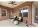 Inviting covered patio featuring comfortable seating, perfect for outdoor enjoyment at 12726 Rusty Blackbird Way, Charlotte, NC 28278