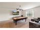 Spacious game room featuring a pool table and comfortable seating at 12726 Rusty Blackbird Way, Charlotte, NC 28278