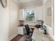 Comfortable home office featuring custom built-ins, granite countertops, and a window for natural light at 12726 Rusty Blackbird Way, Charlotte, NC 28278
