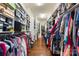 Spacious walk-in closet with custom shelves and racks at 12726 Rusty Blackbird Way, Charlotte, NC 28278
