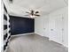 Bedroom featuring an accent wall, ceiling fan, and natural light from the window at 12727 Bullock Greenway Blvd, Charlotte, NC 28277