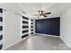 Stylized bedroom with a ceiling fan, accent wall, and a large window for natural light at 12727 Bullock Greenway Blvd, Charlotte, NC 28277