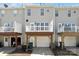 View of the townhome exterior featuring a deck and an attached garage at 12727 Bullock Greenway Blvd, Charlotte, NC 28277