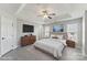 Spacious main bedroom with a tray ceiling, neutral walls, and soft carpet at 12727 Bullock Greenway Blvd, Charlotte, NC 28277