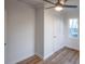 Cozy bedroom featuring a ceiling fan, hardwood floors and natural light from the window at 1605 5Th St, Statesville, NC 28625