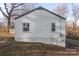 The back side of this charming home is visible, displaying vinyl siding and recently updated windows at 1605 5Th St, Statesville, NC 28625