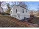 Exterior view of house with an air conditioning unit and windows near a grassy area at 1605 5Th St, Statesville, NC 28625