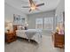 Cozy bedroom featuring neutral paint, carpeted floors, and large windows at 16620 Redding Park Ln, Cornelius, NC 28031