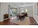 Elegant dining room with chandelier, plantation shutters, and access to the outdoor patio at 16620 Redding Park Ln, Cornelius, NC 28031