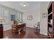 Traditional home office featuring a wooden desk and hardwood floors at 16620 Redding Park Ln, Cornelius, NC 28031