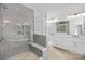 Bathroom with a walk-in shower, bench, and double sink vanity with modern lighting at 1817 S Mint St, Charlotte, NC 28203