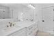 Bathroom featuring double sinks, a large mirror, and modern lighting at 1817 S Mint St, Charlotte, NC 28203