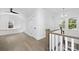 Bright hallway with hardwood floors, white trim, and a cozy window bench at 1817 S Mint St, Charlotte, NC 28203