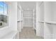 Large walk-in closet with ample shelving and hanging space at 1817 S Mint St, Charlotte, NC 28203