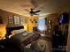 Bright bedroom with ceiling fan, decorative wall hangings, and a comfortable bed at 2027 Downey St, Rock Hill, SC 29732