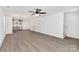 Spacious open-plan living area with wood-look floors, natural light, and neutral paint at 219 E Rice St, Landis, NC 28088