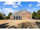 Exterior view of the back of the house featuring a screened in porch and spacious backyard at 2205 Meleto Dr, Waxhaw, NC 28173