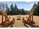 Inviting backyard featuring Adirondack chairs, a fire pit, and a soccer net for outdoor fun at 2205 Meleto Dr, Waxhaw, NC 28173