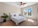 Bedroom with carpet flooring, a ceiling fan, and bright windows at 2205 Meleto Dr, Waxhaw, NC 28173