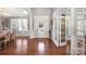 Elegant foyer featuring gleaming hardwood floors, decorative columns, and a bright entryway at 2205 Meleto Dr, Waxhaw, NC 28173