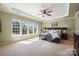 Spacious main bedroom suite with tray ceilings, many windows and neutral carpeting at 2205 Meleto Dr, Waxhaw, NC 28173