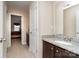 Bathroom featuring granite countertops, dark wood vanity and a view to bedroom at 2605 Lakefront Dr, Belmont, NC 28012