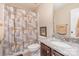 Bathroom features a granite countertop, dark wood vanity, and a shower with decorative curtain at 2605 Lakefront Dr, Belmont, NC 28012