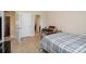 View of a bedroom with blue plaid linens, carpeted floor, and an ensuite bathroom at 2605 Lakefront Dr, Belmont, NC 28012