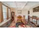 Bright dining room featuring hardwood floors, chandelier, and large windows at 2605 Lakefront Dr, Belmont, NC 28012