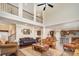 Spacious living room features high ceilings, a central fan, and warm color palette at 2605 Lakefront Dr, Belmont, NC 28012