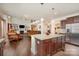 Open floor plan showcases the kitchen island connecting the cozy living spaces at 2605 Lakefront Dr, Belmont, NC 28012