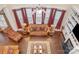 A beautifully decorated living room featuring hardwood floors, a ceiling fan, and a cozy fireplace at 2605 Lakefront Dr, Belmont, NC 28012